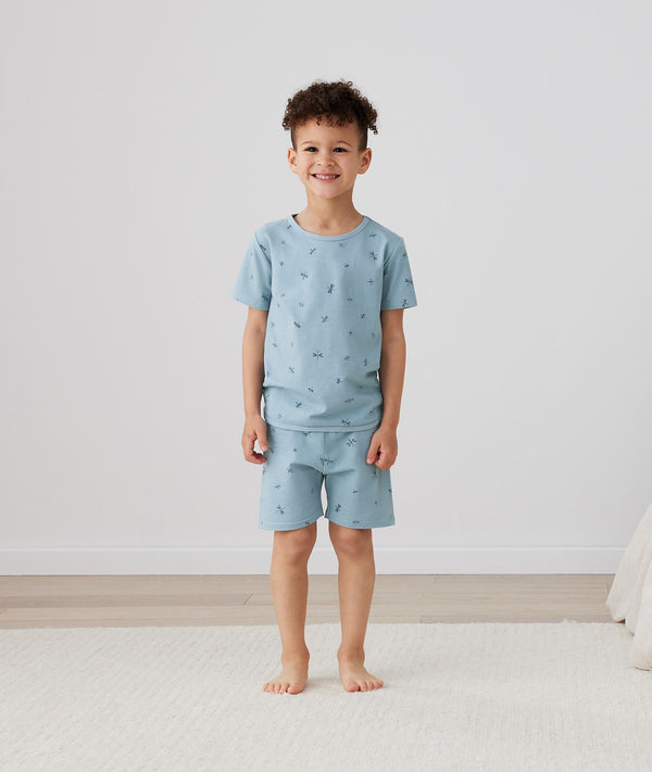 Kid wearing ergoPouch Short Sleeve Pajamas 0.2 TOG Dragonflies