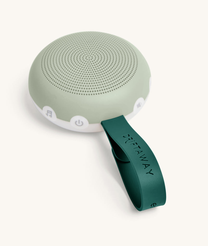 ergoPouch Drift Away White Noise Machine, featuring control buttons and strap for hanging and carrying.
