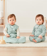 Infants wearing ergoPouch Long Sleeve Romper in Sage