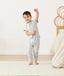 Toddler standing in ergoPouch Sleep Onesie 1.0 TOG Grey Marle