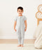 Preschooler standing, wearing an ergoPouch Sleep Onesie 1.0 TOG Grey Marle