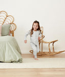 Child playing in ergoPouch Sleep Onesie 2.5 TOG Grey Marle, warm for the winter