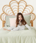 Child sitting in ergoPouch Sleep Onesie 2.5 TOG Grey Marle, warm for the winter