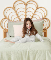 Child sitting in ergoPouch Sleep Onesie 2.5 TOG Grey Marle, warm for the winter