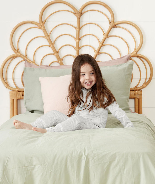 Child sitting in ergoPouch Sleep Onesie 2.5 TOG Grey Marle, warm for the winter