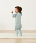 Toddler laughing in ergoPouch Sleep Onesie in Sage