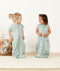 Toddlers laughing at each other in ergoPouch Sleep Suit Sack in Sage