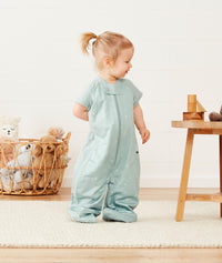 Toddler wearing ergoPouch Sleep Suit Sack in Sage