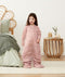 Smiling child in ergoPouch Sleep Suit Sack 2.5 TOG Berries, a warm sleep sack with legs