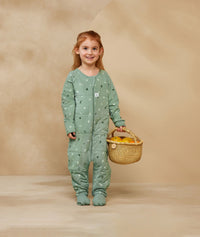 Child playing in ergoPouch Sleep Onesie 3.5 TOG Sweet Orchard, warm for the winter