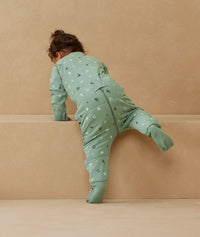 Child playing in ergoPouch Sleep Onesie 3.5 TOG Sweet Orchard, warm for the winter