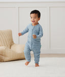 Toddler running, wearing an ergoPouch Sleep Onesie 2.5 TOG Dragonflies