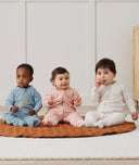 Three infants sitting wearing ergoPouch Sleep Onesie 3.5 TOG Daisies, Dragonflies, and Oatmeal Marle