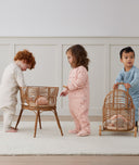 Three children playing in ergoPouch Sleep Onesie 2.5 TOG Daisies Dragonflies, and Oatmeal Marle; warm for the winter