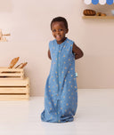 Toddler smiling wearing ergoPouch Jersey Sleep Suit Sack 0.2 TOG Petit Pretzel