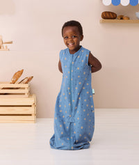 Toddler smiling wearing ergoPouch Jersey Sleep Suit Sack 0.2 TOG Petit Pretzel
