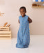 Toddler smiling wearing ergoPouch Jersey Sleep Suit Sack 0.2 TOG Petit Pretzel