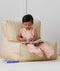 Child playing in ergoPouch Jersey Sleep Suit Sack 0.2 TOG Daisies, a light sleeping bag that converts to a sleeping bag with legs