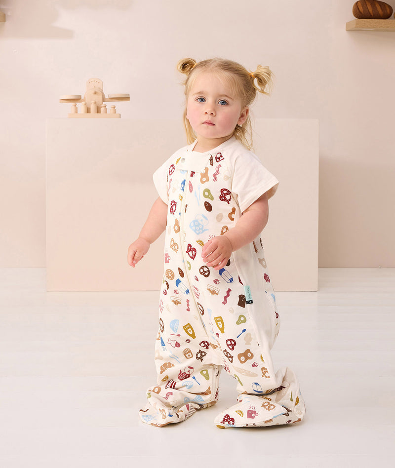 Toddler looking at the camera in ergoPouch Sleep Suit Sack 1.0 TOG in Bon Appetit