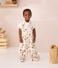 Toddler wearing ergoPouch Spring Sleep Suit Sack 1.0 TOG Bon Appetit, converts from a sleep bag to a sleep bag with legs