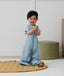Toddler wearing an ergoPouch Sleep Suit Sack 1.0 TOG Dragonflies