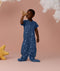 Playing toddler wearing an ergoPouch Sleep Suit Sack 1.0 TOG Starbeam, a sleeping bag that converts to a sleep suit with legs.