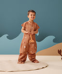 Preschooler wearing an ergoPouch Sleep Suit Sack 1.0 TOG Sunny