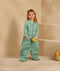 Preschooler wearing an ergoPouch Sleep Suit Sack 3.5 TOG Sweet Orchard