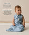 Infant wearing a blue sleeveless Sleep Sack 1.0 TOG Dragonflies with text highlighting organic cotton and stretchy & bell-shaped design.