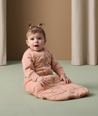 Infant wearing ergoPouch Sleep Sack with Sleeves in Elephant Parade
