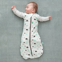 Baby wearing a Cocoon Swaddle Sack with is arms out
