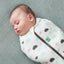 Sleeping baby swaddled in ergoPouch Cocoon Swaddle Sack