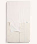 Product shot of the ergoPouch HugMe Blanket in Caramel Grid