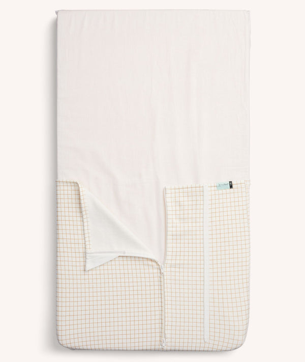 Product shot of the ergoPouch HugMe Blanket in Caramel Grid