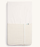 Product shot of zipped up ergoPouch HugMe Blanket in Caramel Grid