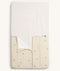Product shot of an ergoPouch HugMe Blanket in Daisy Sprinkle