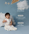 Child in an ergoPouch Sleep Sack 1.0 TOG Daydream sitting on a blue floor with clouds and a kite, surrounded by text about product features.