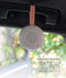 A lightweight, circular Drift Away White Nosie machine attached to a car handle. Text overlay titled 