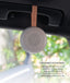 A lightweight, circular Drift Away White Nosie machine attached to a car handle. Text overlay titled 