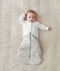 Baby lying a winter Sleeping Sack with added warmth with the Arm Warmers