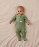 Five newborns wearing an ergoPouch Long Sleeve Romper in different colours