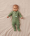 Five newborns wearing an ergoPouch Long Sleeve Romper in different colours