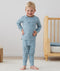 Toddler wearing an ergoPouch Long Sleeve Pajamas in Dragonflies