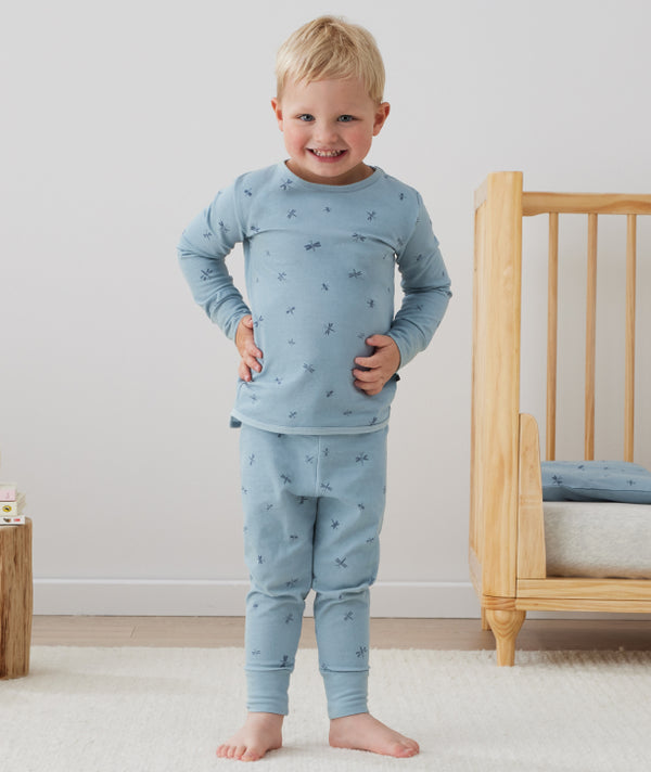 Toddler wearing an ergoPouch Long Sleeve Pajamas in Dragonflies