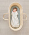 Newborn being swaddled in a ergoPouch Cocoon Swaddle Sack 0.2 TOG Grey Marle