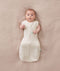Baby sleeping with arms out in a ergoPouch Cocoon Swaddle Sack 0.2 TOG Oatmeal Marle
