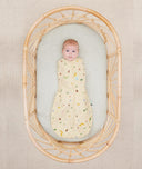 Newborn wearing an ergoPouch Cocoon Swaddle Sack 0.2 TOG Critters with arms in