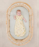 Newborn in ergoPouch Cocoon Swaddle Sack 0.2 TOG Critters, transitioned to arms out sleeping