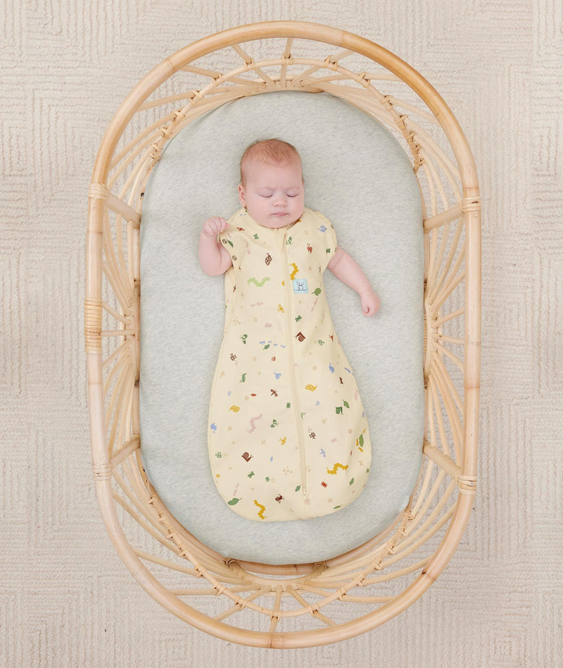 Newborn in ergoPouch Cocoon Swaddle Sack 0.2 TOG Critters, transitioned to arms out sleeping