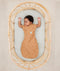 Baby sleeping with arms out in ergoPouch Cocoon Swaddle Sack 0.2 TOG Honey Bees